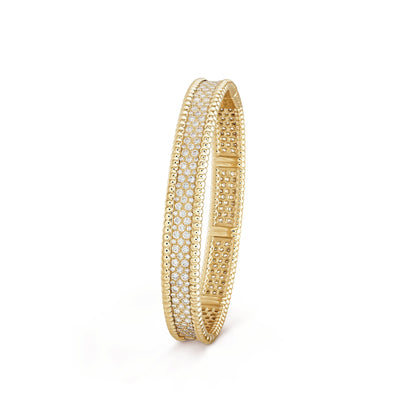 Angled view of Fleuron Paris Perlee Bangle - 18k gold plated with cubic zircon rows and beaded edges, luxurious and radiant finish.