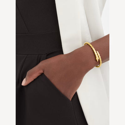 Fleuron Paris Bracelet - 18K Gold Plated Serpenti bracelet styled on wrist, highlighting its sleek, modern elegance for formal wear.