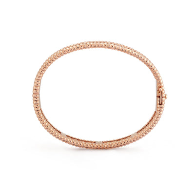 Fleuron Paris Perlee Bangle in rose gold tone - 18k gold plated with beaded texture and secure clasp, elegant and refined design.