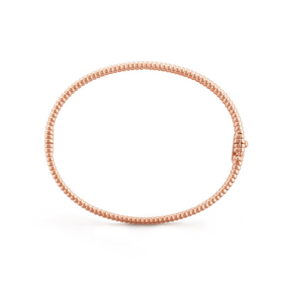 Fleuron Paris Perlee Bangle in rose gold tone - 18k gold plated with delicate beaded texture, perfect for elegant wrist styling.
