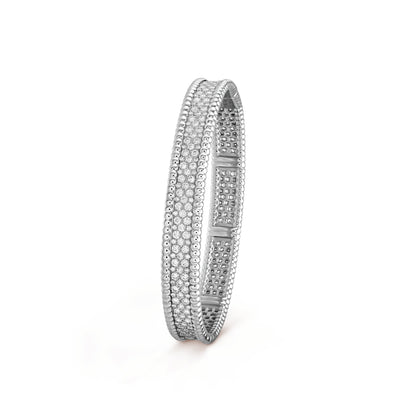 Angled view of Fleuron Paris Perlee Bangle in silver tone - 18k gold plated with cubic zircon, elegant and versatile for any occasion.